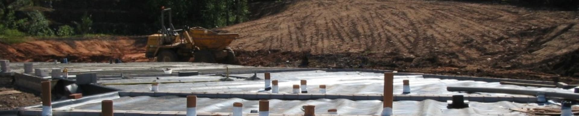 construction site with damp proof membranes being installed 